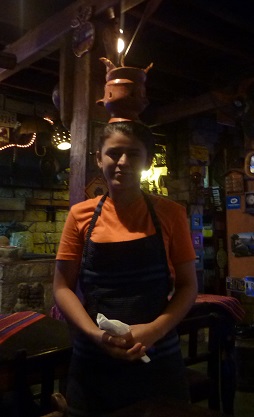 Kebab starter brought out on waitresses head in Copan Ruinas, Honduras