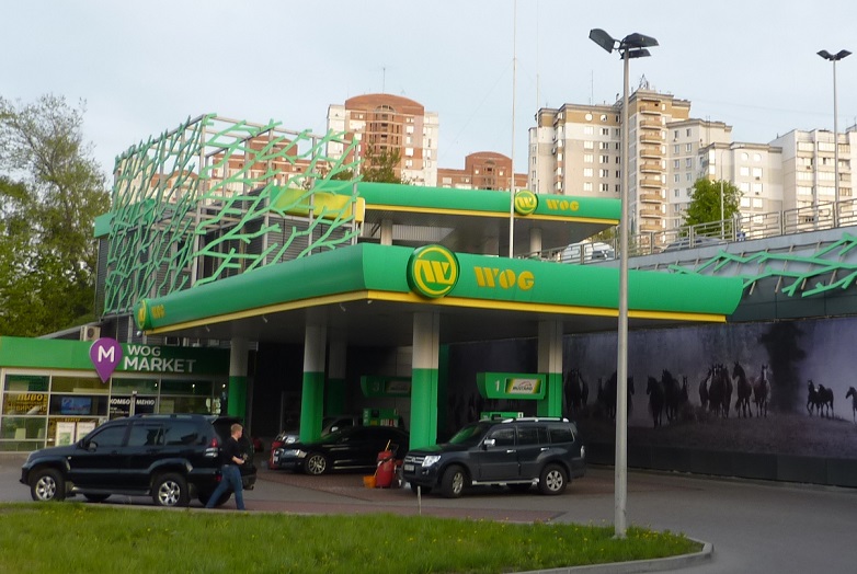 Two-storey petrol station with wild horse mural in Kiev